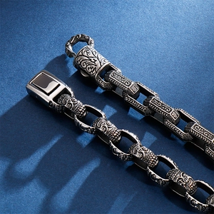 Retro stainless steel men's bracelet with intricate square Buddha and skull engravings