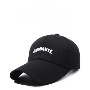 Close-up of white 3D embroidered ENCHANTE logo on black cotton twill baseball cap