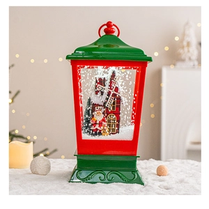 Close-up of a Christmas snow globe lamp with Santa Claus and a rotating windmill