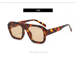Detail view of tortoiseshell oversized square sunglasses with amber tinted lenses