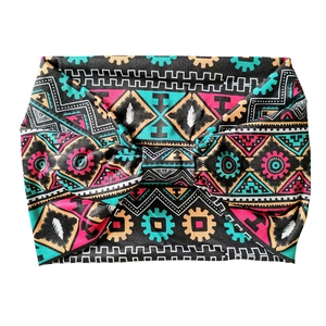 Bohemian paisley yoga headband with colorful ethnic geometric patterns on white background