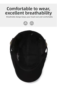 Detail view of the breathable lining and golden metal buckle on the black beret cap