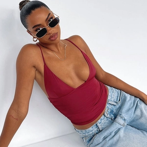 Close-up of a burgundy deep V-neck crop tank top with soft elastic fabric texture