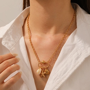18K gold-plated stainless steel necklace with shell and starfish pendants on model