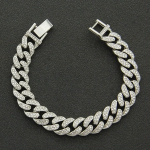 Sparkling silver iced-out Cuban link bracelet with rhinestones on black background