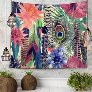 Detail of bohemian wall tapestry featuring vibrant tropical flowers and peacock feathers