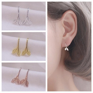 Minimalist leaf earrings in silver, gold and rose gold finishes shown with model view
