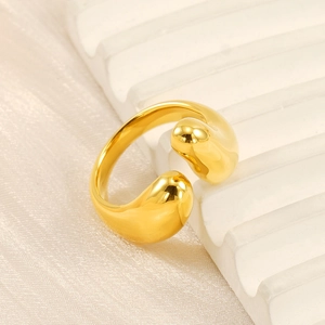 Macro detail of an 18k gold plated stainless steel open ring with teardrop design