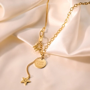 Gold plated heart and M letter pendant necklace with Good Luck charm on silk