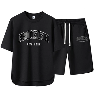Close-up of black breathable fabric texture on Brooklyn graphic t-shirt and shorts