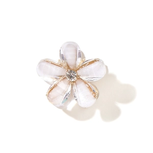 Mini flower hair claw clip with creamy white resin petals and a center crystal stone
