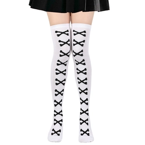 Close-up of gothic white thigh high socks featuring black crossbone pattern for Halloween