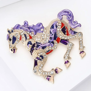 Detailed macro view of enamel horse brooch with purple finish and white rhinestones