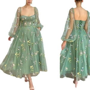 Sage green tulle evening dress with floral embroidery and sheer puff sleeves