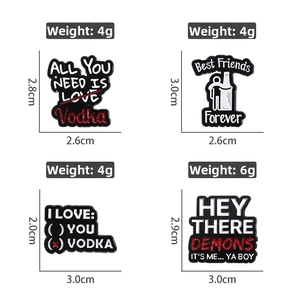 Detailed view of four funny enamel pins with motivational and vodka themed text designs