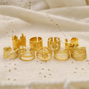 9-piece set of French vintage 18K gold plated irregular rings with sun and eye motifs