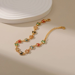 Detail of 18K gold-plated bracelet featuring multi-colored butterfly charms with lobster clasp