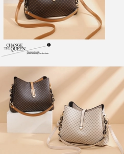 Detail of printed bucket bags in brown and beige colors with leather straps