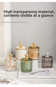 Detail view of vertical striped storage jars with decorative metallic bear handles
