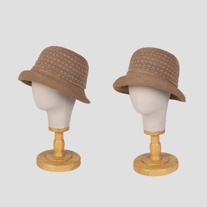 Elegant linen knit bucket hat with small brim and dotted pattern for sun protection