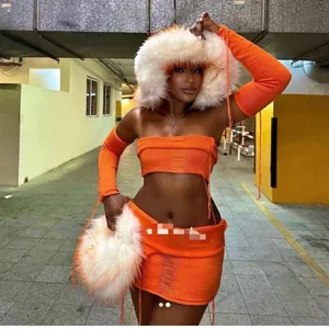 Detail of fluffy orange and white faux fur hat with thick punk street style texture