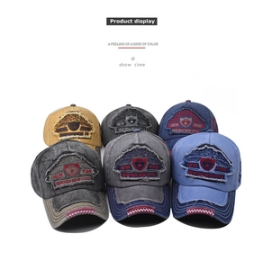 Detailed view of vintage washed cotton baseball caps with New York 1985 embroidery