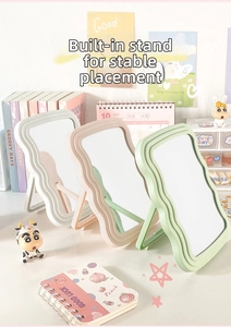 Detail of macaron wave mirrors with foldable back stands for stable desktop placement