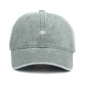 Detailed view of R-letter embroidery on a vintage washed grey cotton baseball cap
