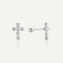 Macro shot of silver beaded cross stud earrings with screw-back ball closures