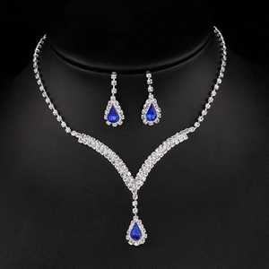 Parure de bijoux de mariée étincelante avec collier de pierres bleues et boucles d'oreilles