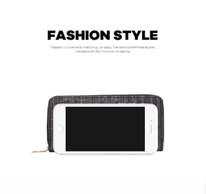 Deep gray fabric texture long wallet with gold zipper, shown fitting a smartphone inside