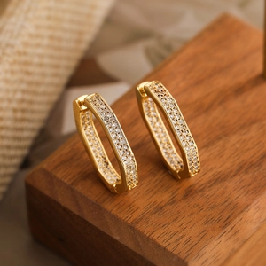 Gold plated geometric hexagonal hoop earrings with sparkling white zircon insets