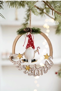Detailed Christmas ornament with a gnome, candy cane, and wooden ring on pine branches