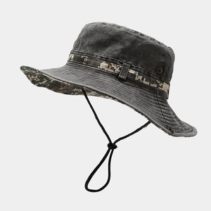 Detail view of washed dark grey outdoor bucket hat with camo strap and ventilation holes