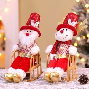 Christmas Santa and Reindeer dolls with red sequins sitting on mini rocking chairs