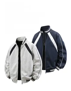 Flat lay of loose fit color block track jackets with striped sleeves and stand collar