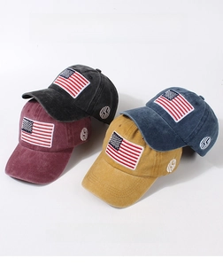 Detail of multi-color vintage cotton baseball caps with American flag embroidery
