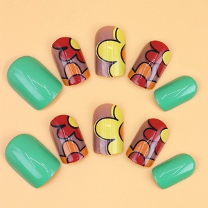 Short round green press-on nails with retro pop art floral patterns and glossy finish