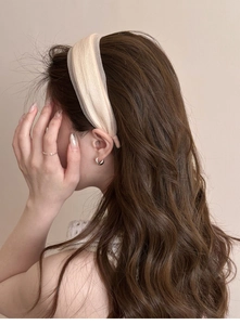 Elegant cream tulle wide headband shown on model to enhance hairstyle volume and grace