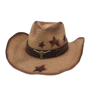 Vintage woven straw cowboy hat with star prints and a bull head metal buckle detail