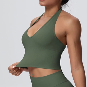 Detail of high-elasticity dark green halter yoga bra showing seamless ribbed fabric stretch