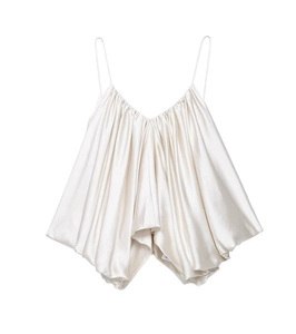 Detail of cream pleated satin camisole top showing silky texture and ruched fabric design