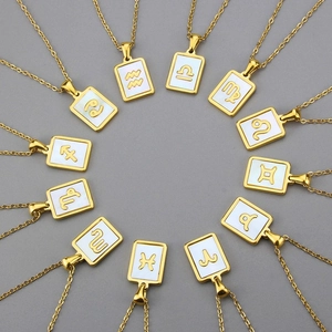 Golden stainless steel zodiac square pendant necklaces with pearl shell inlay on grey background