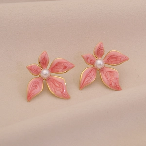 Elegant gold flower stud earrings with pink enamel petals and a centered pearl detail
