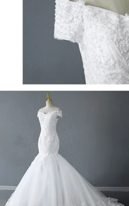 Close-up of intricate lace embroidery and pearl detailing on the elegant white wedding dress