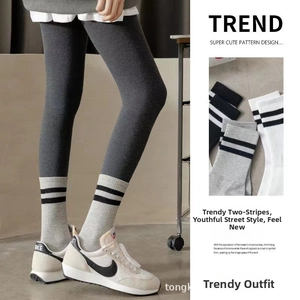 Detail of ribbed cotton mid-calf socks with double stripes and high elastic texture