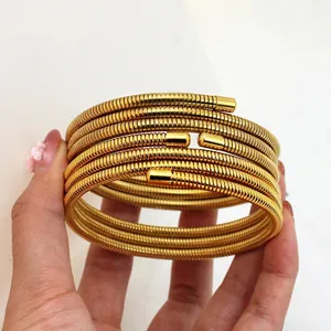 Minimalist multi-layer gold titanium steel spring bracelet with spiral texture design
