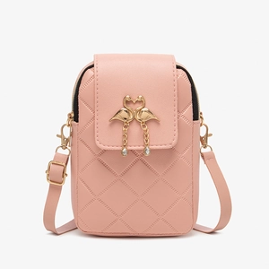 Pink quilted crossbody phone bag with golden flamingo accent and adjustable strap