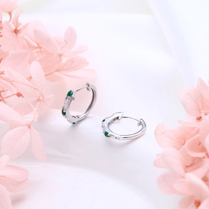 Elegant S925 sterling silver hoop earrings with green gemstones and white floral accents
