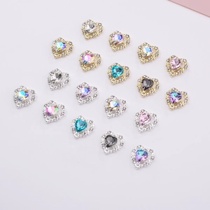 Detailed view of colorful heart-shaped nail charms with sparkling rhinestone borders